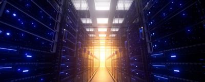 server racks in data center with brightly lit aisle, Mainframe Services & Solutions | DXC Technology Insights